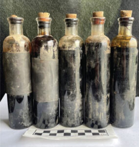 The five little bottles of toxic creosote found in the Whittaker/Fletcher attic.